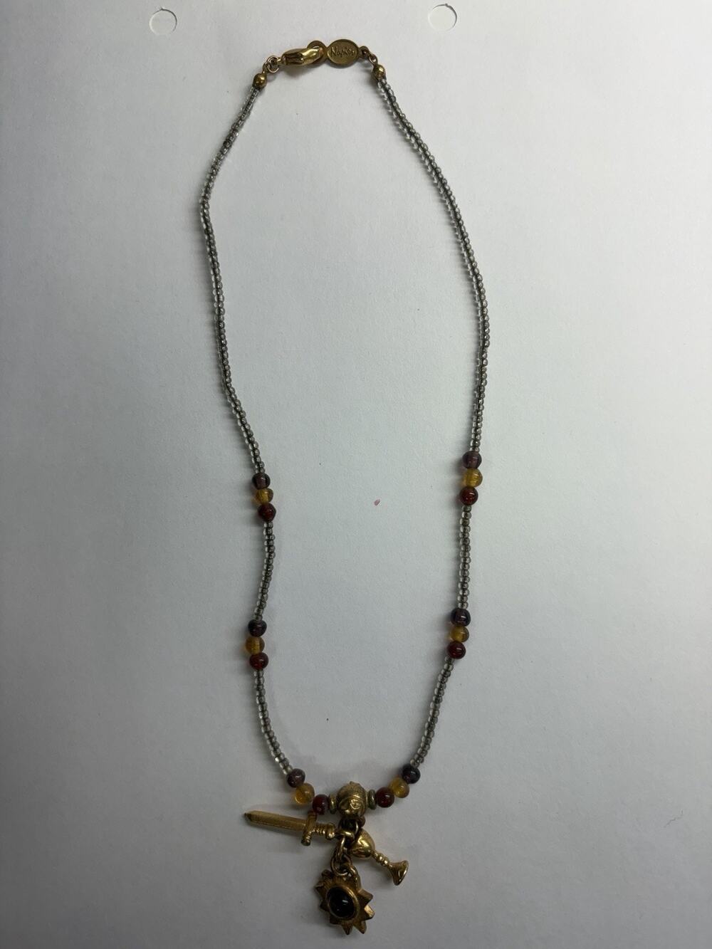 Rare ANTIQUE Cursive Napier Charm Necklace -Sword, Sunburst, Chalet